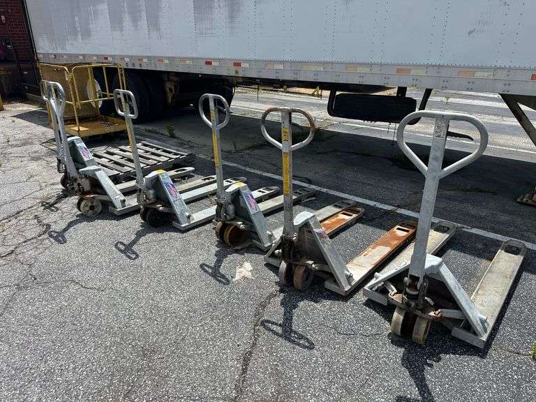 Six Pallet Jacks (some inoperable)