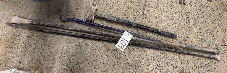 Grouping of Pry Bars and Sledge Hammer