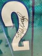 Larry Johnson Autographed Framed and Matted Charlotte Hornets Jersey