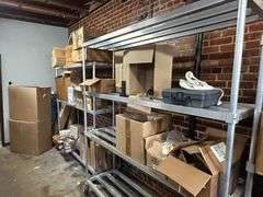 Contents of New Stock Room includes New Steel Toe Rubber Boots, New Gloves, New Food Trays, New Floor Mats, New Protective Face Sheilds, New Carts, and all Shelving
