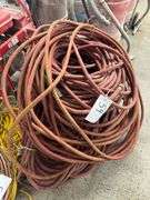 Bundle of Red Industrial Water Hoses
