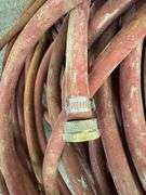 Bundle of Red Industrial Water Hoses