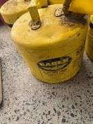 Four Yellow 5-Gallon Eagle Gas Cans