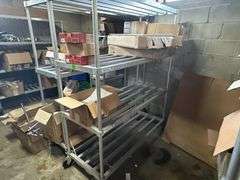 Contents of New Stock Room includes New Steel Toe Rubber Boots, New Gloves, New Food Trays, New Floor Mats, New Protective Face Sheilds, New Carts, and all Shelving