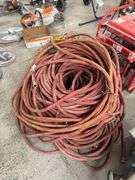 Bundle of Red Industrial Water Hoses