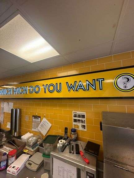 Large Lighted Sign on Wall