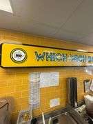 Large Lighted Sign on Wall