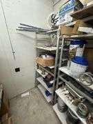 Aluminum Storage Racks with Assorted Paints, Stains & Cleaning Supplies