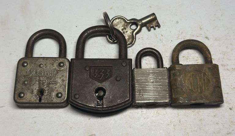 Collection of Four Old Padlocks with Key image