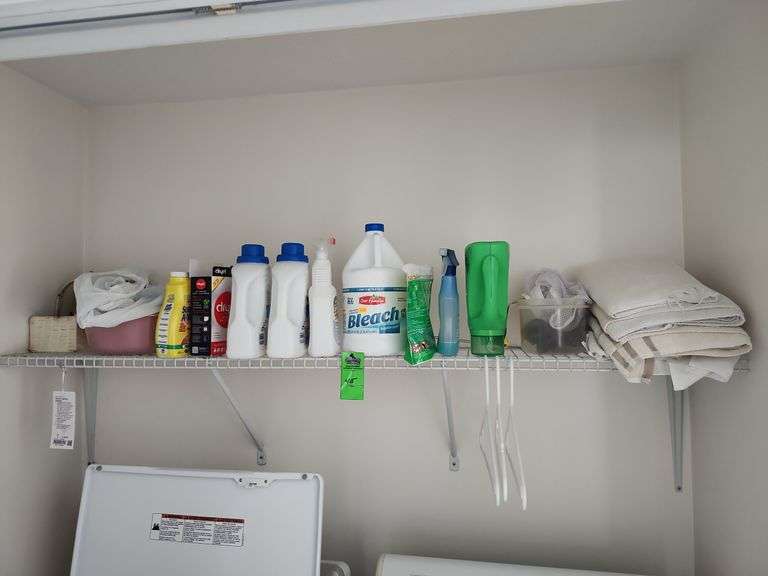 Cleaning supplies and towels everything on the shelf