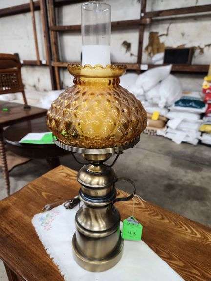 vintage amber quilted glass hurricane table lamp with a brass finish.