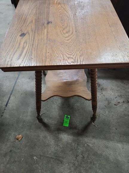 antique oak parlor table with barley twist legs and a lower shelf.