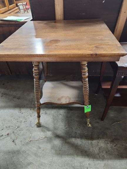 antique oak parlor table with barley twist legs and a lower shelf.