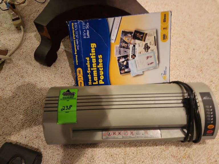 Laminator with laminating pouches image