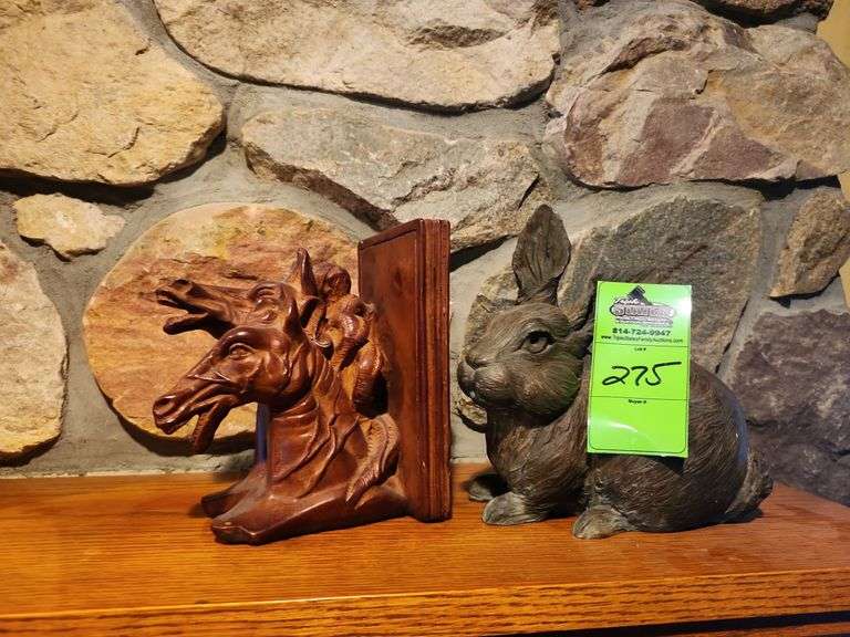 Wooden horse bookend and bronze rabbit image