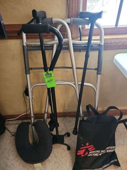 Three canes a walker and other miscellaneous items image