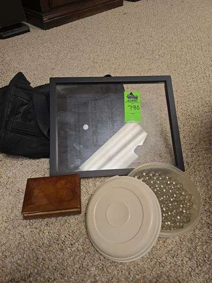 Small Tumi duffle bag, tub of clear decorative marbles, glass frame, and genuine alabaster keepsake box image