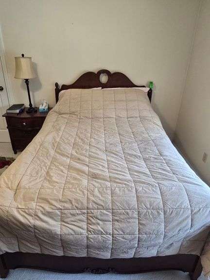 Full size bed and nightstand image