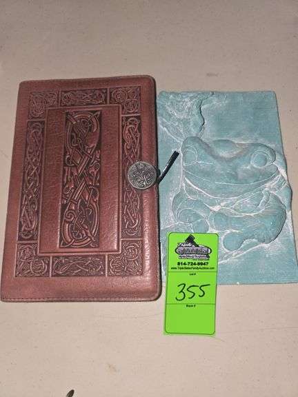 Blank leather case journal and clay frog wall decor image