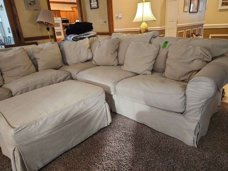 Corner sofa with ottoman and pillows image