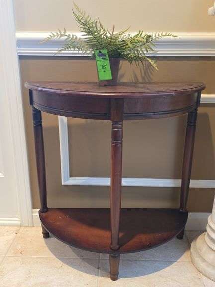 Half moon entry table with small plant image