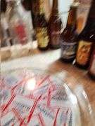 Milk bottles, beer bottles, Budweiser serving tray, and cars
