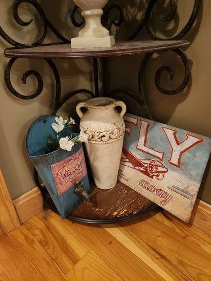 Metal corner shelf with contents