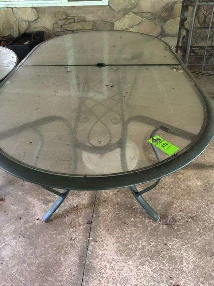 Oval glass top table with umbrella stand