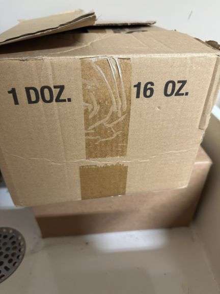 Two unopened cases of glass bottles