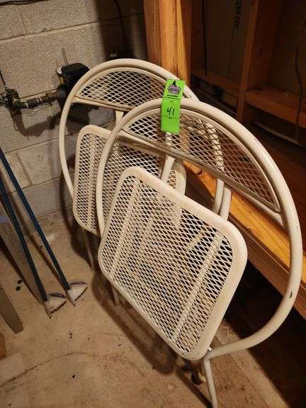 Two metal patio chairs