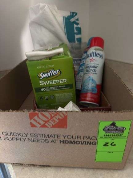 Two swiffer’s dust pan broom miscellaneous box of laundry supplies, shammy and lightbulbs