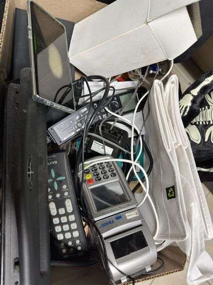 Black desk chair with box of office supplies ￼