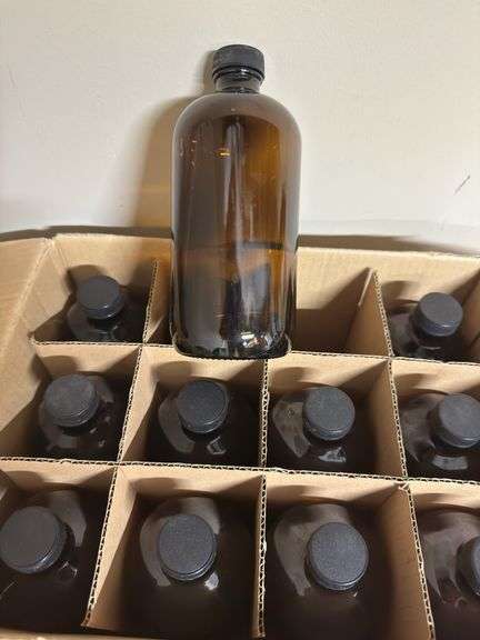 Two unopened cases of glass bottles