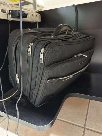 Black desk on wheels two briefcases ￼