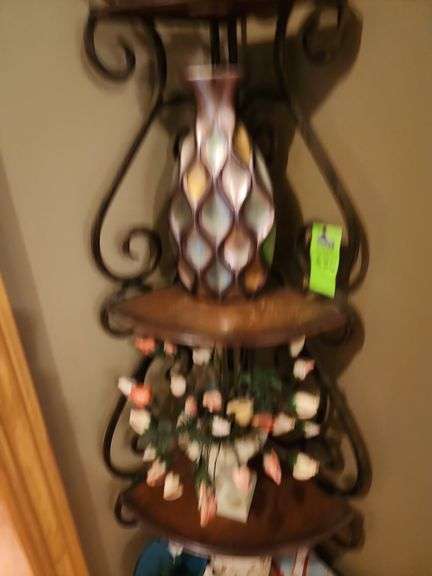 Metal corner shelf with contents