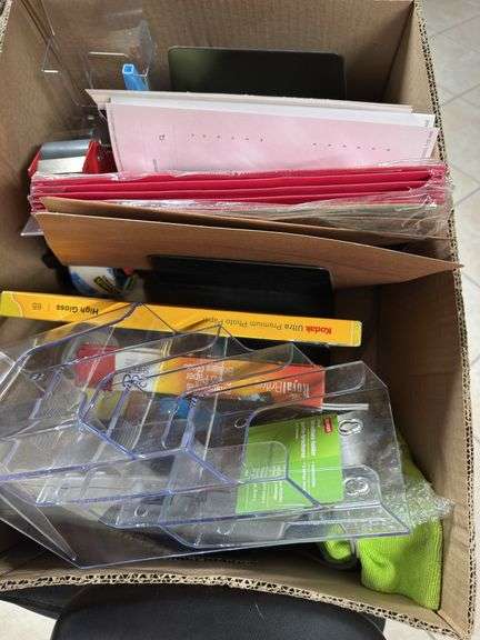 Black office chair with box of office supplies