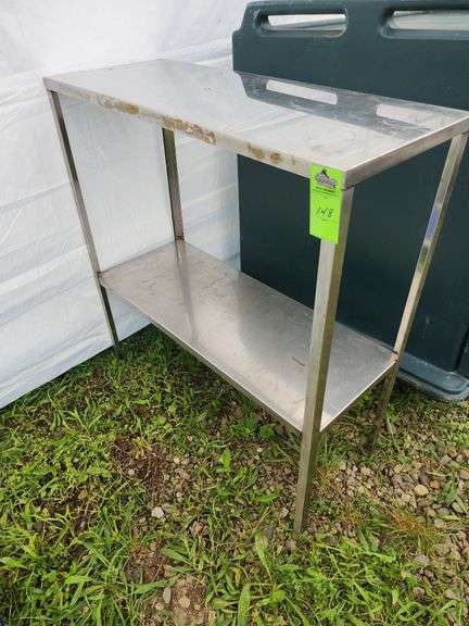 Stainless steel table 35 in X 14 in