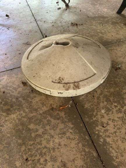 Oval glass top table with umbrella stand