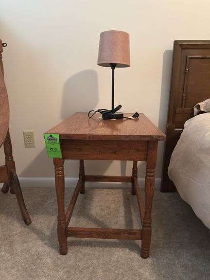 Wooden side table with small lamp