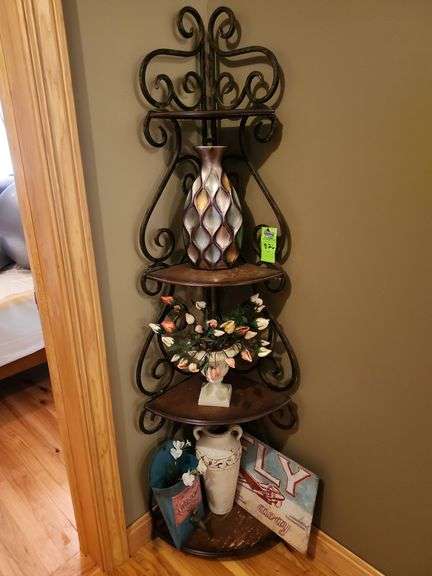 Metal corner shelf with contents