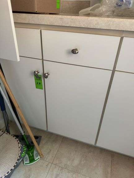 Contents of cupboard under laundry room counter