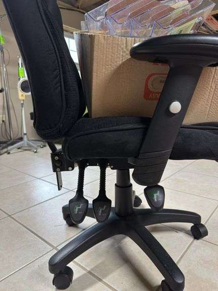 Black office chair with box of office supplies
