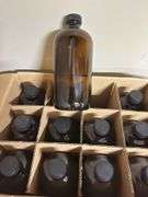 Two unopened cases of glass bottles