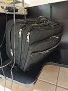 Black desk on wheels two briefcases ￼