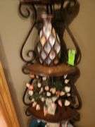 Metal corner shelf with contents