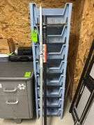 Set of plastic stackable bins and two security poles