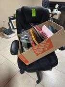 Black office chair with box of office supplies