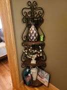 Metal corner shelf with contents