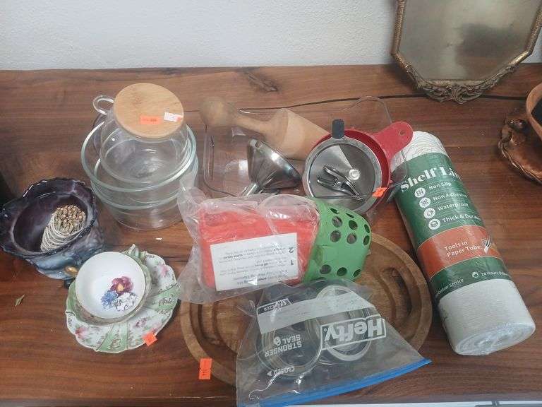 Kitchen supplies, tea cups sage burner wooden tray bowls and shelf liner. image