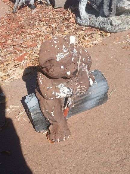 Bear fishing off log yard decoration image